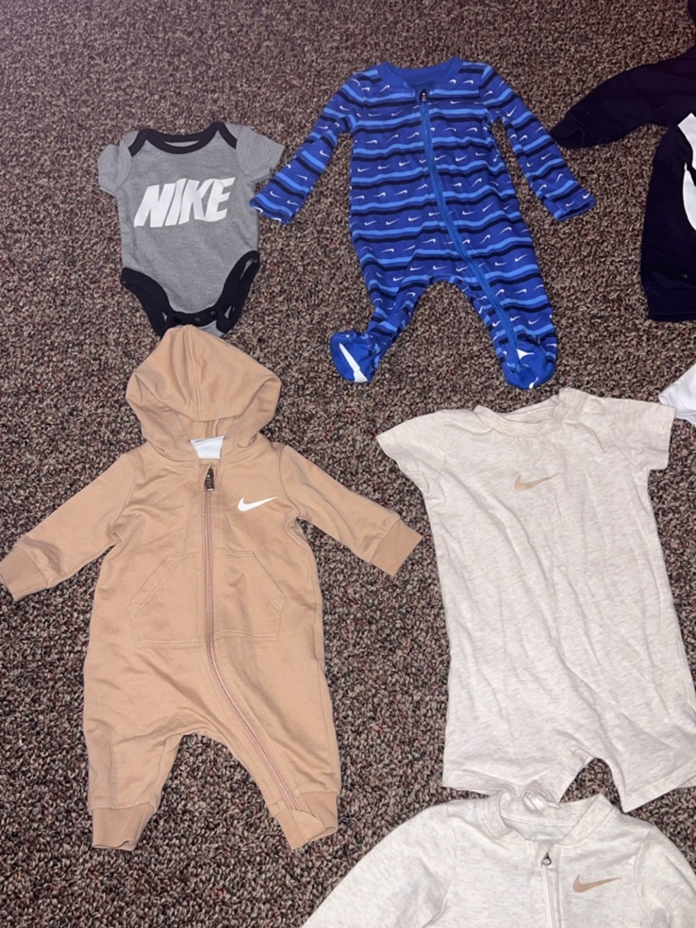 Lot of 8 Nike and 1 Burt’s bees baby clothes